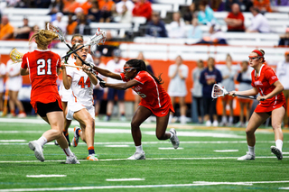 Mary Rahal tries to avoid the stick of a Cornell defender. 