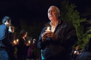 Graham Herbert, the principal of Lockerbie Academy in Scotland, pays respect to the 35 SU students who died in the Pan Am Flight 103 bombing at the candlelight vigil. This year is the 25th anniversary of the tragedy, which will be honored during Remembrance Week 2013.