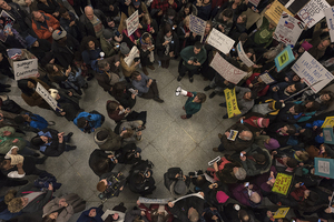 Hundreds of protestors gathered at Terminal A at Syracuse's Hancock International Airport on Sunday night to protest President Donald Trump's recent executive order banning immigration from seven majority Muslim countries. 