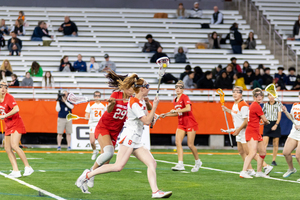 Maddy Baxter converges in on goal and tees up a shot against Cornell's Shannon Brazier. The Orange featured ten different scorers for the second consecutive game to remain undefeated