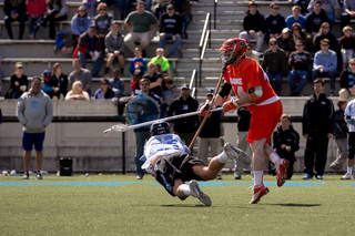 Two players dive for a loose ball. 