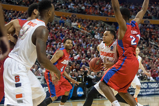 Ennis finds a seam in the Dayton defense and looks to finish at the rim. 