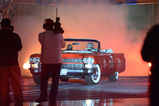 Syracuse women's basketball head coach Quentin Hillsman comes out to Orange Madness in a vintage red car after his players were announced. 