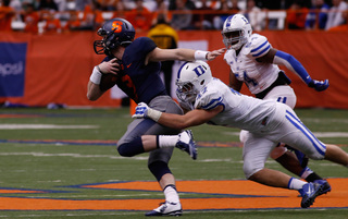 Mitch Kimble tries to break free from a tackle. He ran for 50 yards on the afternoon. 