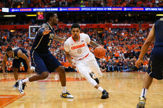 Gbinije looks for an opening past Pittsburgh's defense. The junior forward had 12 points on Saturday afternoon.