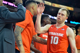 Cooney exits a game for the final time this season, high-fiving members of the team on the bench.