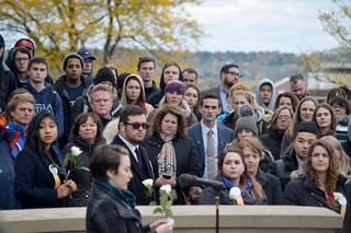 The crowd watches as Brenner reads a small speech for Pamela Herbert.
