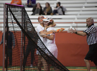 Syracuse celebrates one of its 23 goals on Friday. 