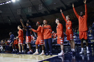 SU's bench celebrates on the sideline.