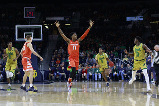 Oshae Brissett holds his hands up in transition.