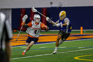 Jake Nelson pushes the ball toward the opposing net.