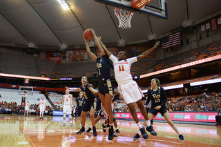 Cooper goes for a block. Syracuse dominated throughout and will next face No. 6 Notre Dame.