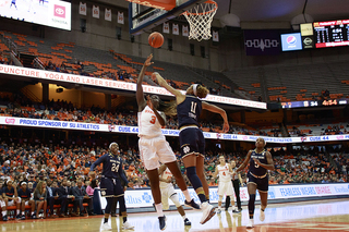 Maeva Djaldi-Tabdi shoots a hook shot on the right block.