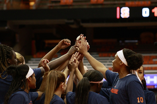 Syracuse huddles together.