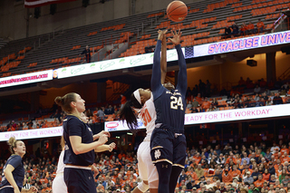 Arike Ogunbowale and Kadiatou Sissoko fight for a rebound.