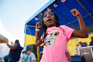 Ameena Holman dances along to Hit the Quan by iLoveMemphis as a part of a competition among other fairgoers.