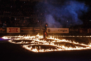 As the timer finally reaches zero on the jumbotron, Marcus Mast appears as the first of the riders to emerge into the flame lit arena.