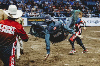 Lino gets bucked into the air off of his bull.