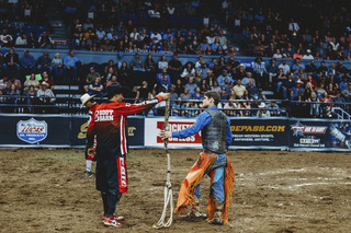 Tristen Marshall retrieves his bull rope after his ride is scored.