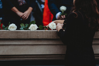 Each Scholar places a rose in honor of those they represent.