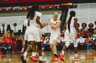 Syracuse players celebrate freshman guard Taleah Washington's buzzer-beater to end the first half.