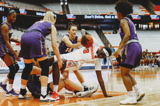 Multiple players fight for a loose ball.