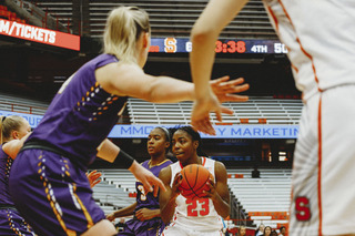 Lewis controls the ball despite multiple Albany players surrounding her.