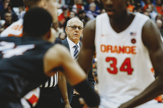 Jim Boeheim looks on at Sidibe.