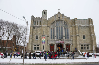 Protesters arrive to the United Methodist Church, the march's final destination, to hear speakers share perspectives on women's rights. 