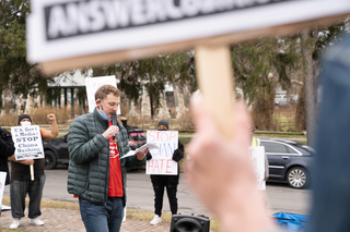 At the rally in Thornden Park, Collin Chambers, a doctoral student and member of Syracuse Party for Socialism and Liberation, speaks about the relationship between China and the U.S.