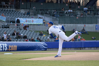 Thomas Szapucki pitches down the diamond toward the RailRides player up to bat. 